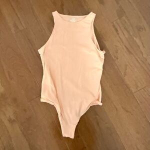SKIMS sweet peach body suit .Worn 1 time, so pretty & soft, too small for me.